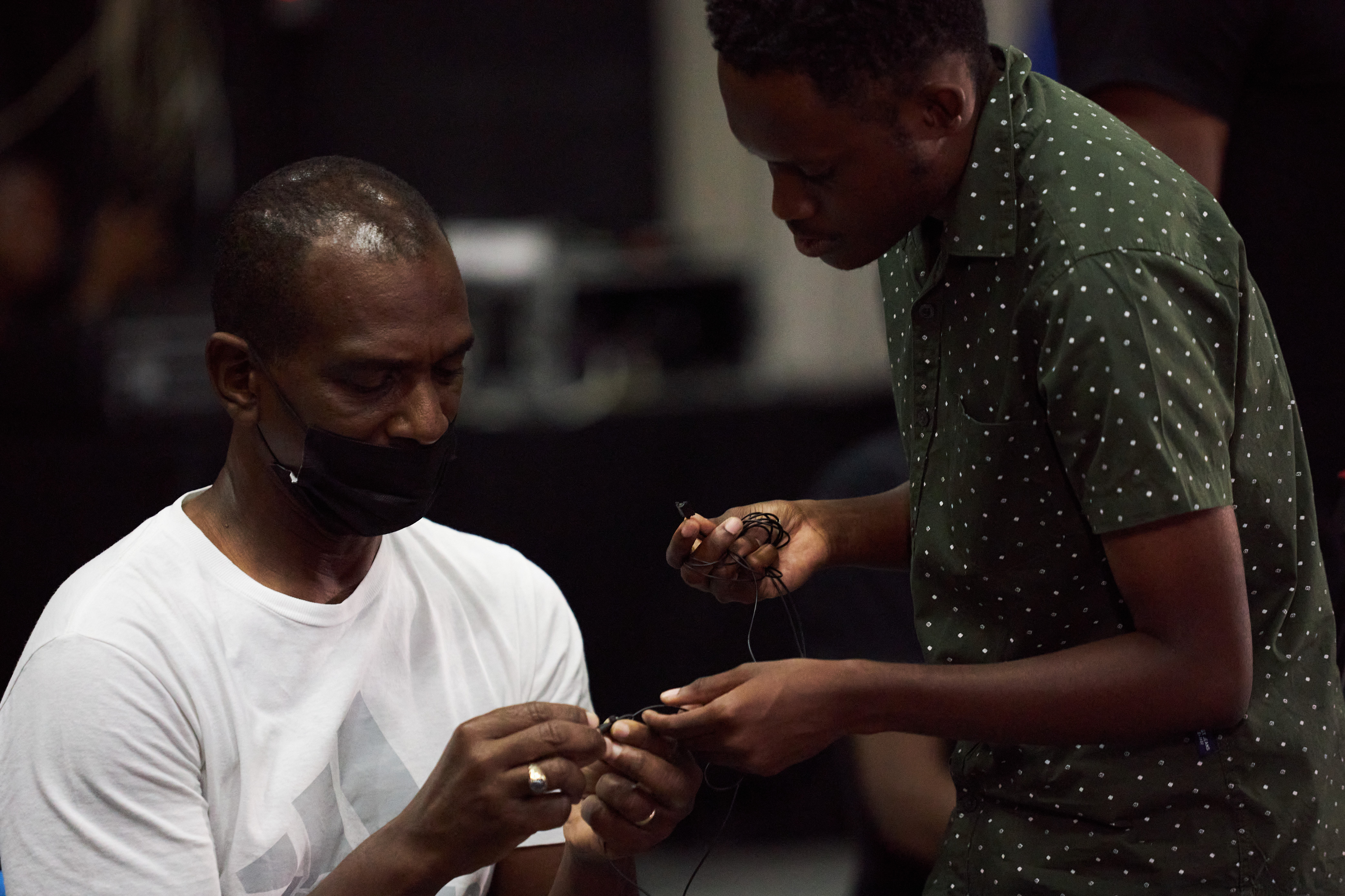 Rigging a lavalier microphone during the JAFTA Location Sound Workshop