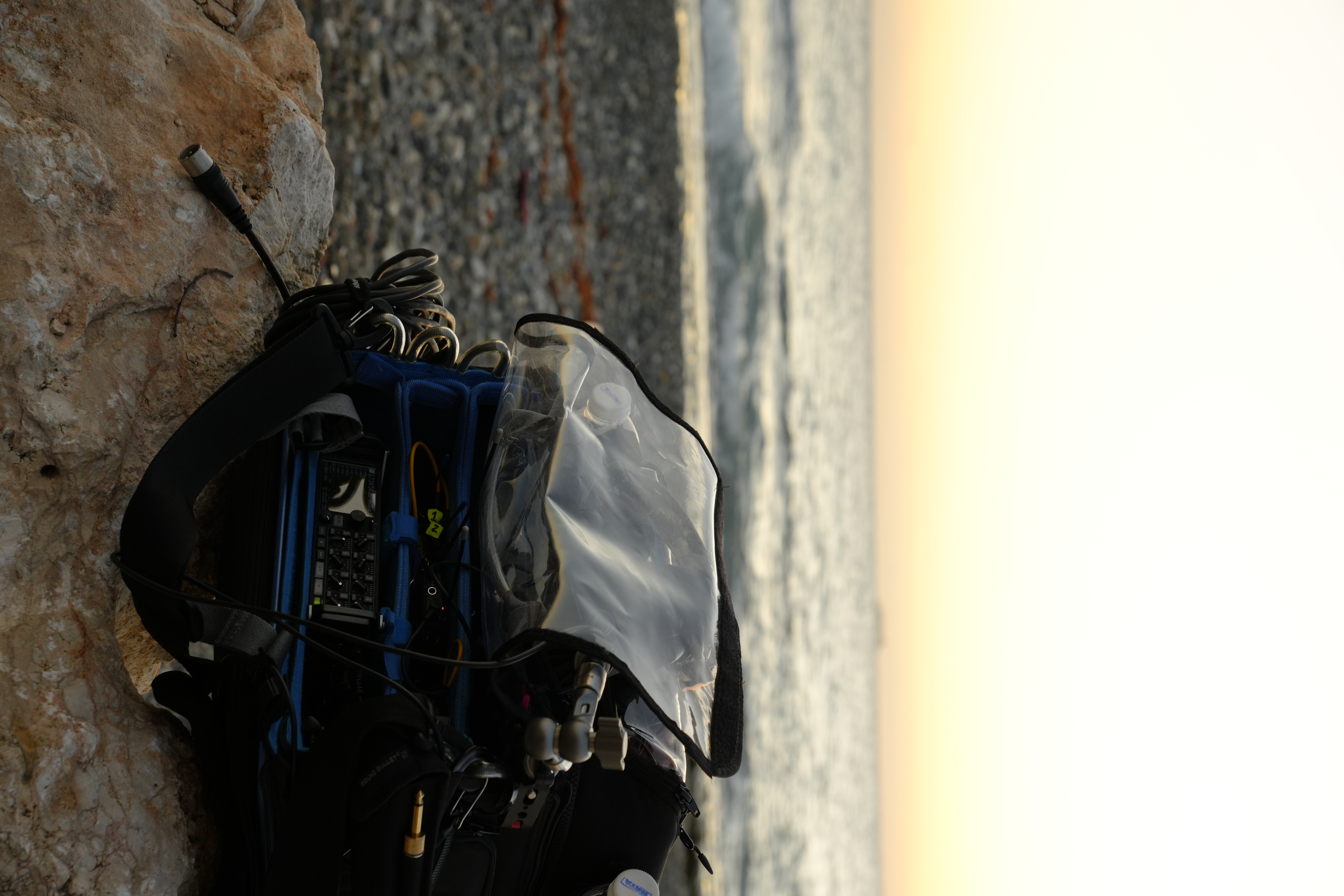 Sound bag and Zoom F8n Pro on the beach at sunset